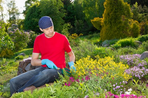 Garden maintenance team inspecting tools and equipment for safety